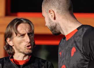 Did Modric only make eleven appearances at AC Milan before his contract is ready