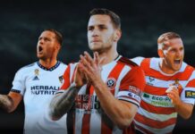 Sheffield United legend Billy Sharp sets up with a container full of football memorabilia